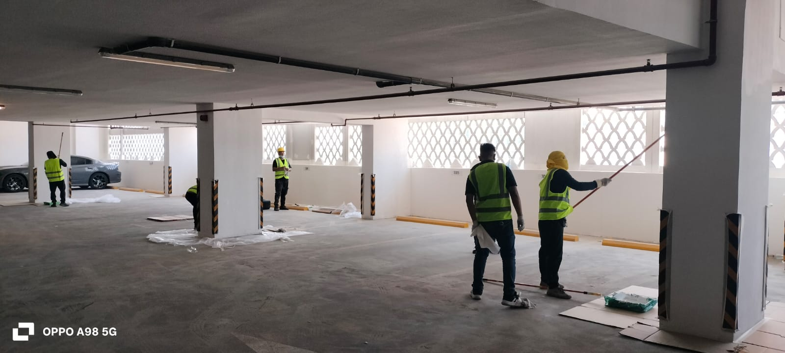 Completed parking level — clean walls, ceilings & bay lines
