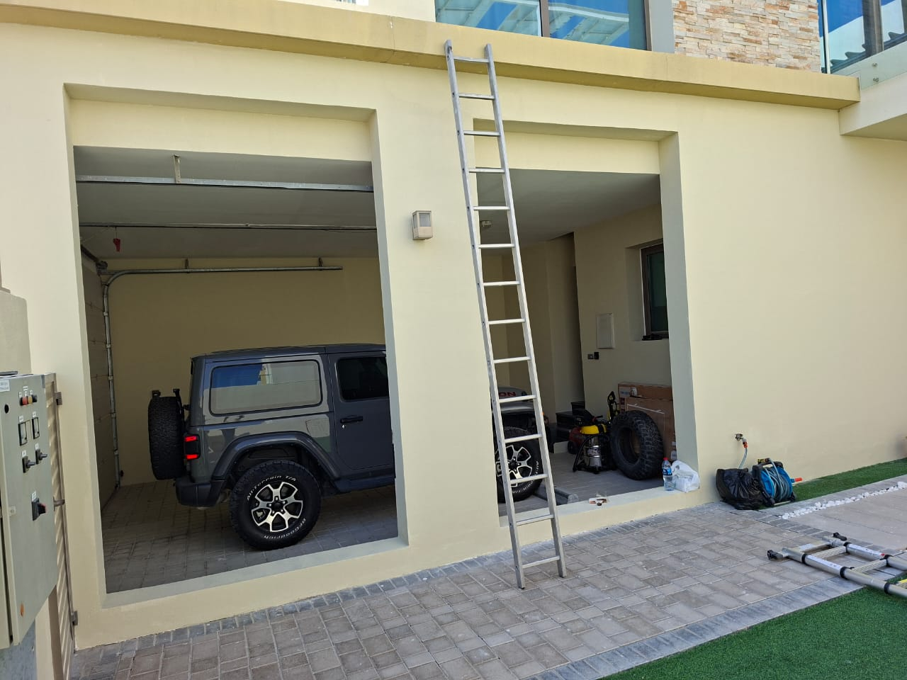 Freshly painted garage frontage with clean wall tones and completed openings
