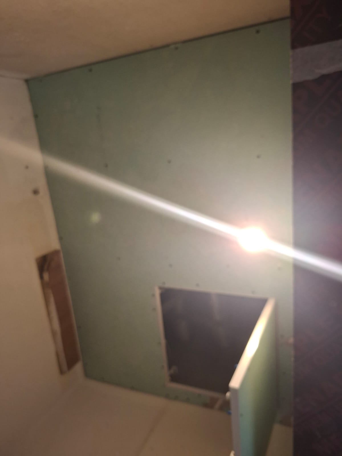 Moisture-resistant gypsum board fixed with access hatch