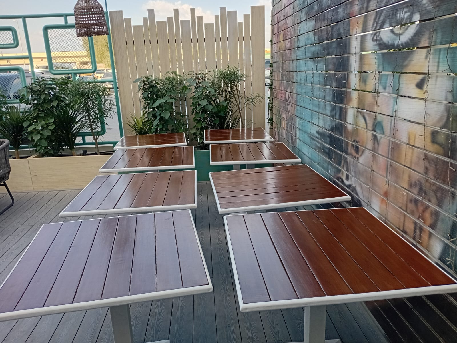 Completed carpentry restoration across the full outdoor dining set