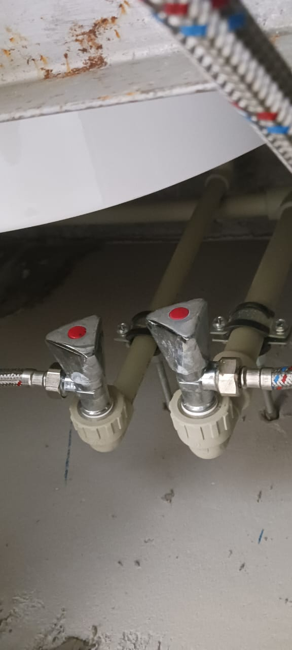 Completed pipework alignment under the installed tank