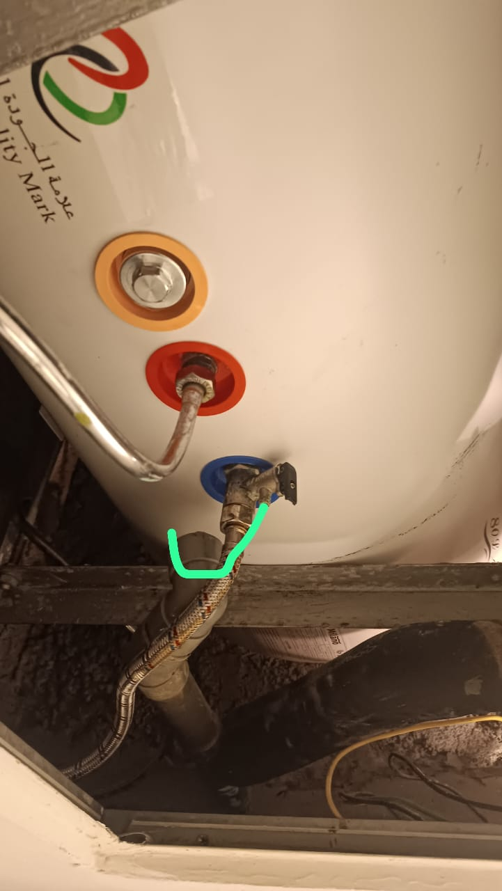 Marked cold-water connection highlighted before replacement