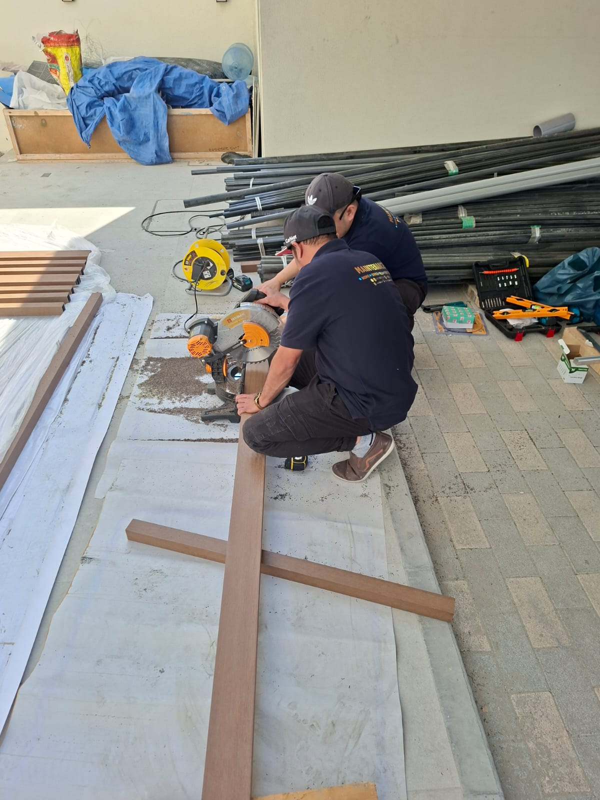 Levelling and aligning the finished composite beam along the rooftop parapet
