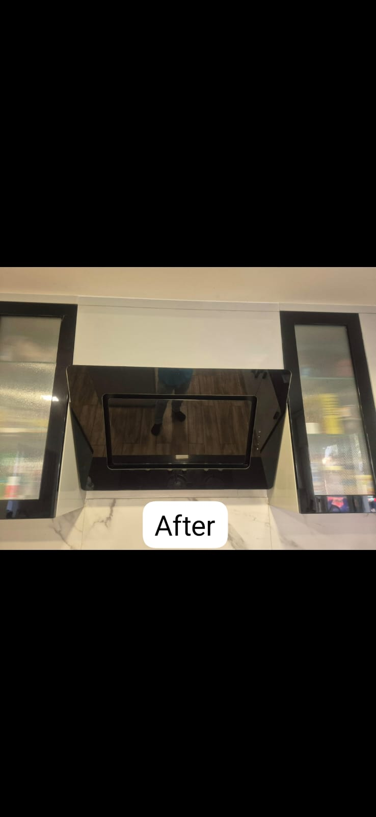 Installed hood — clean marble backsplash restored